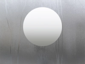 A circle-shaped defogger at the center of a mirror.