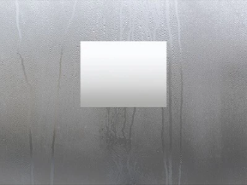 A rectangle-shaped defogger at the center of a mirror.